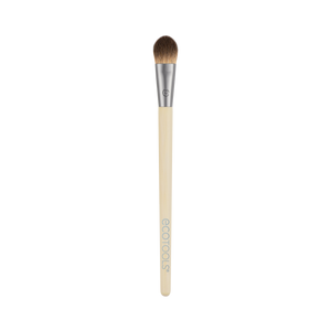 All-over eye makeup brush, beige handle, tapered brown bristles.