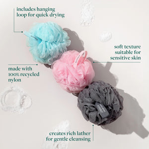 Set of bath sponges in blue, pink, and dark gray mesh