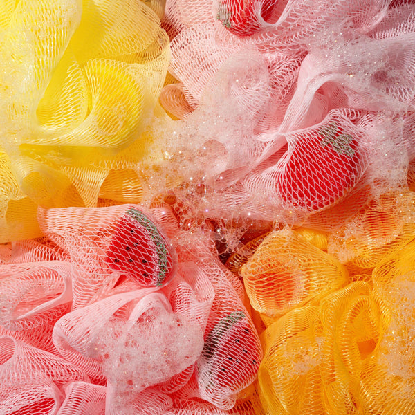 Assorted colorful mesh bath sponges with crinkled texture