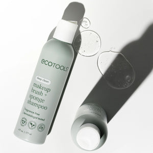 ECOTOOLS makeup brush and sponge shampoo bottle with small water droplets
