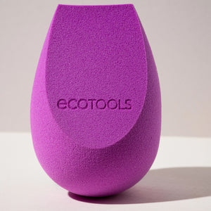 Purple teardrop makeup sponge close-up with ecotools logo, textured blending surface