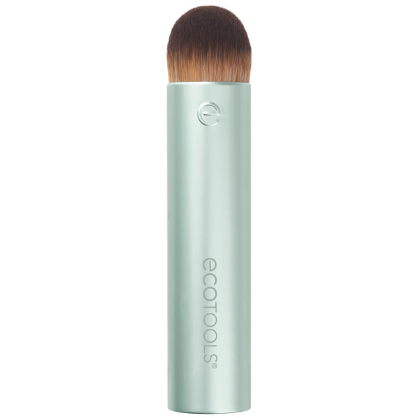 Domed blending makeup brush with dense brown bristles on a light mint tube handle