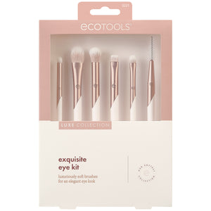 Boxed eye makeup brush kit showing seven rose-gold brushes with white bristles