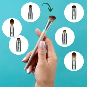 Beige-handled eye makeup brush with dark tapered bristles and teal ferrule