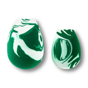 Teardrop facial sponge duo in green-and-white marble pattern.