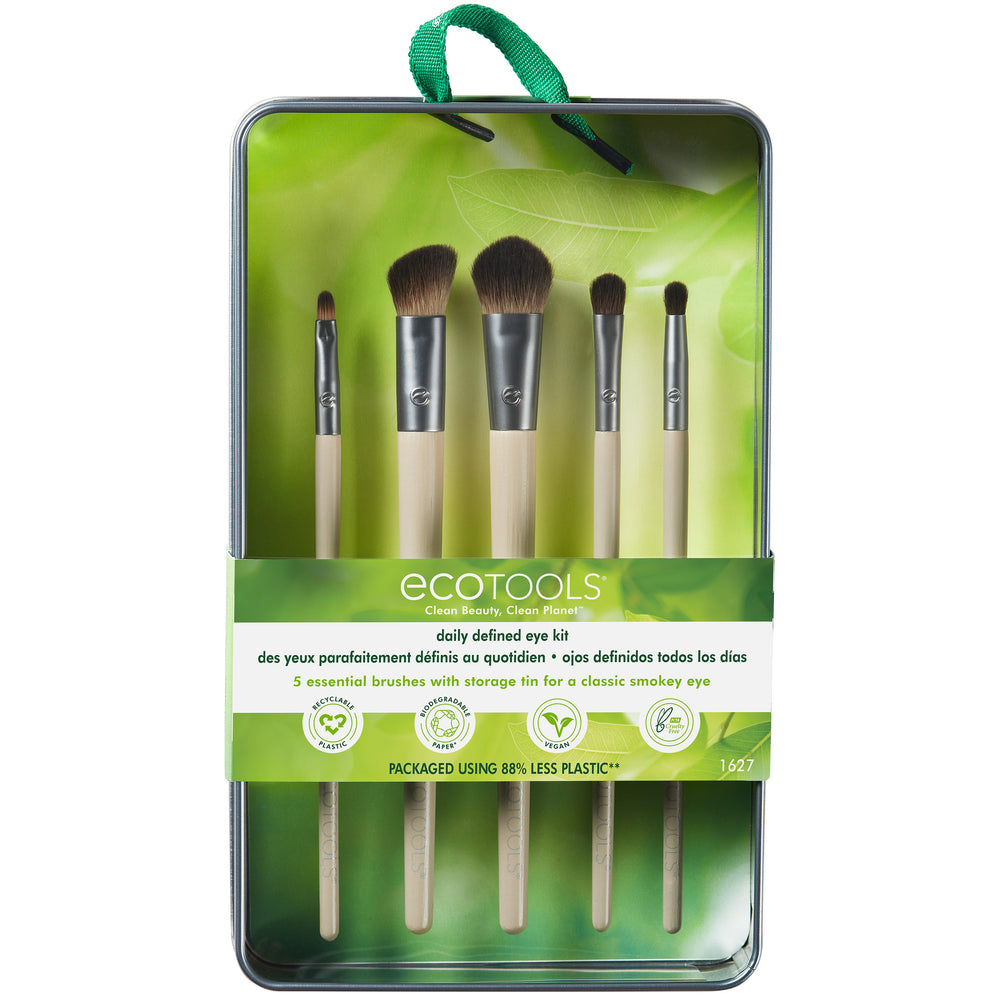 Eye makeup brush set with embossed metal tin and five beige-handled brushes