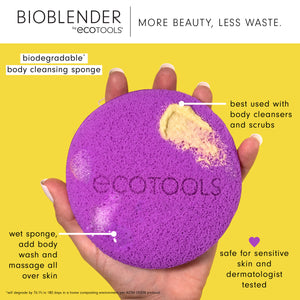 Purple round body cleansing sponge with loop, held in hands