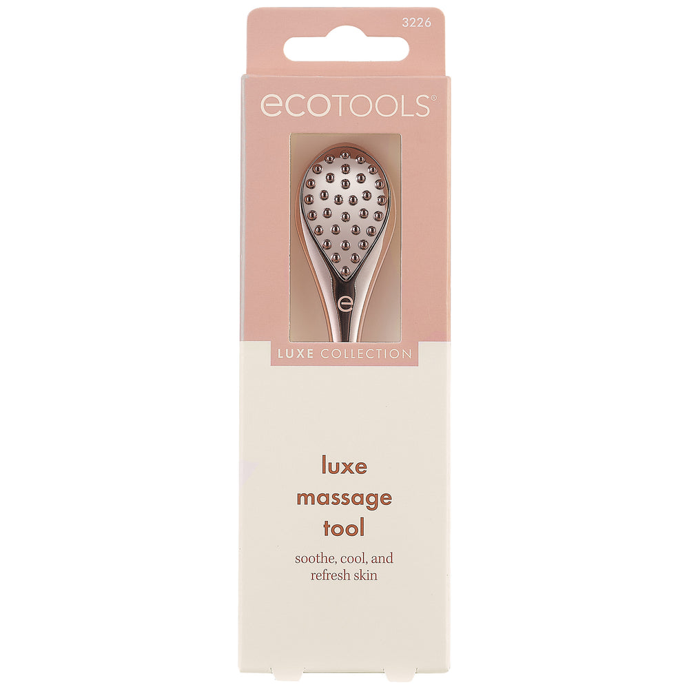 Rose-gold handheld massage tool with textured knob head