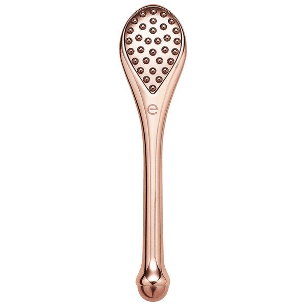 Rose-gold handheld massage tool with textured knob head