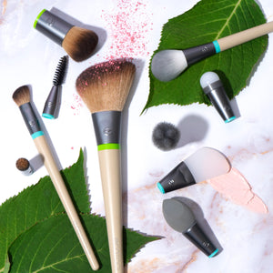 Assorted face makeup brushes with beige handles and dark silver ferrules, visible bristles