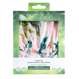 Packaged shower cap showing pastel tropical leaf print and elastic edge